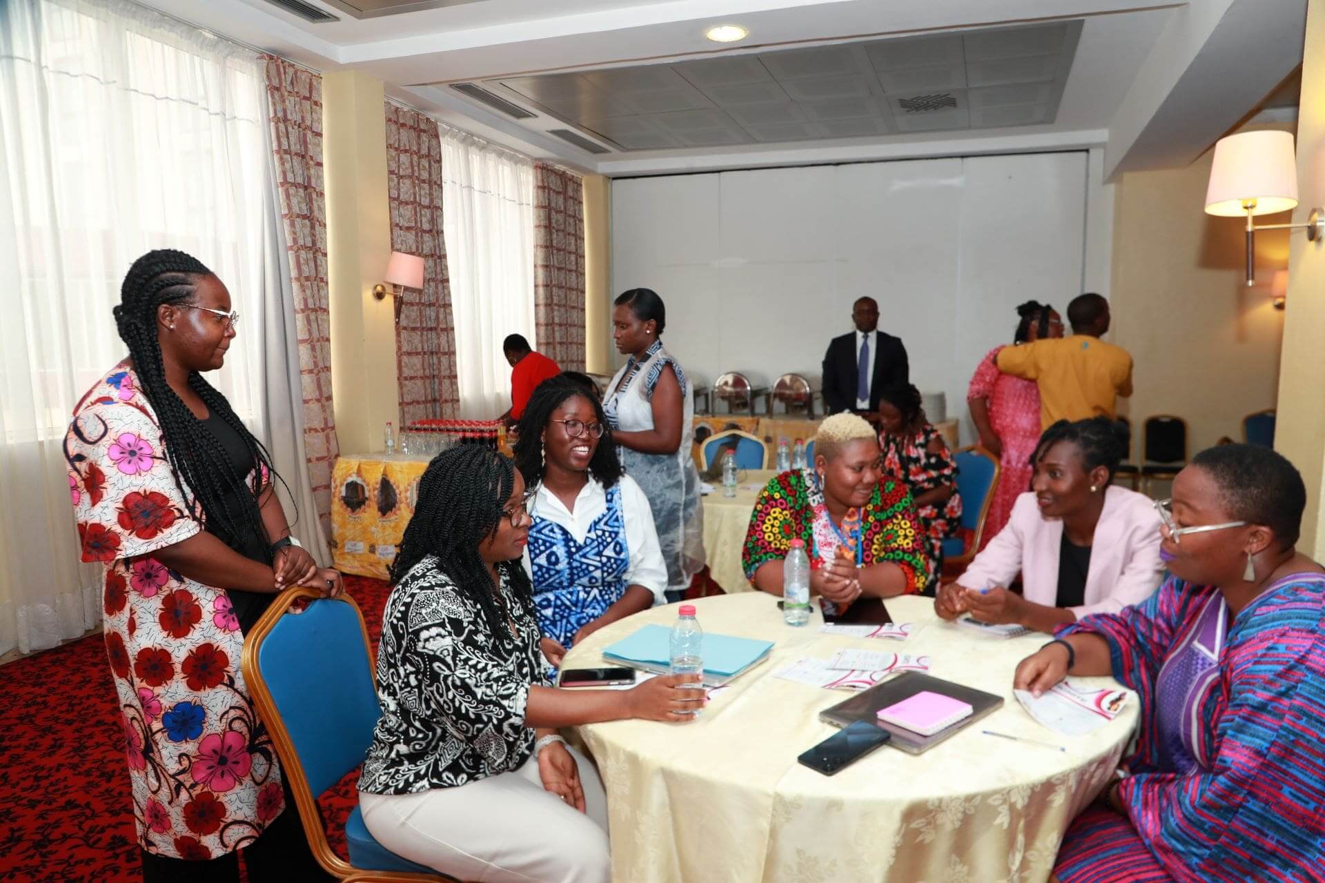 Participants having a conversation during the Cameroon launch of the IGNITE project