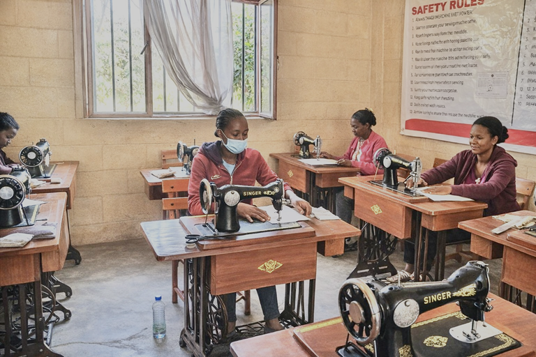 Girls receive hands-on training in producing reusable sanitary pads, helping them stay in school and gain practical skills for their future.